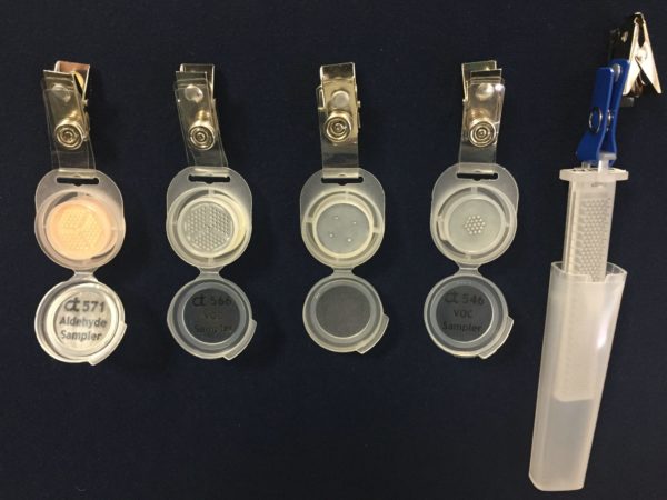 Several opened Assay Technology air monitoring badges.