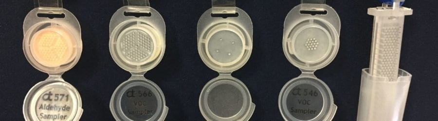 Several opened Assay Technology air monitoring badges.