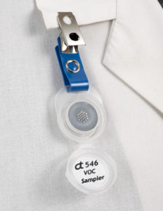 Assay Technology 546 High Capacity Organic Vapor Monitor, open and clipped to collar.