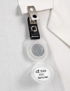 Assay Technology 566 Organic Vapor Monitor, open and clipped to collar