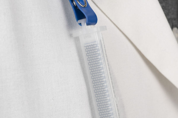 Assay Technology 525 TraceAir II Organic Vapor Monitor clipped to collar